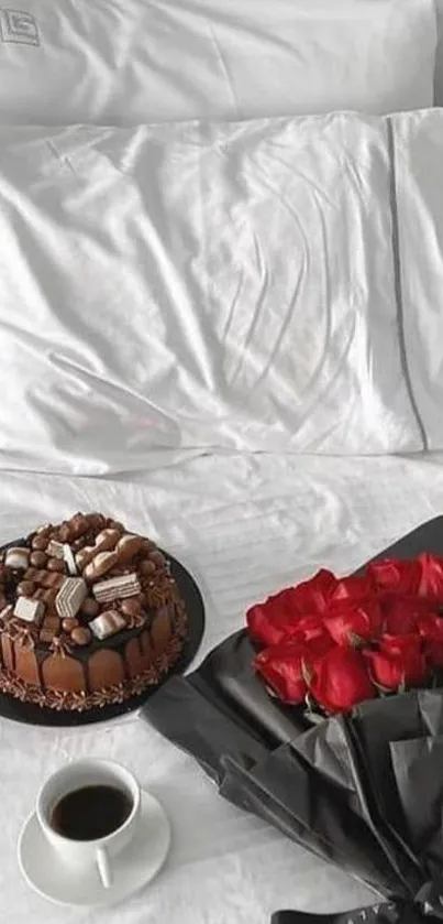 Chocolate cake with red roses on white bedspread.