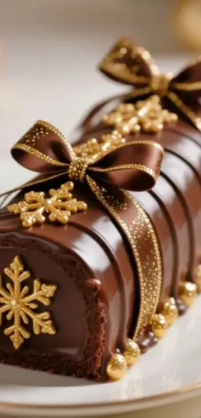 Chocolate Yule log with gold decorations.