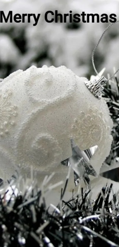 Elegant white Christmas bauble with decorative elements.