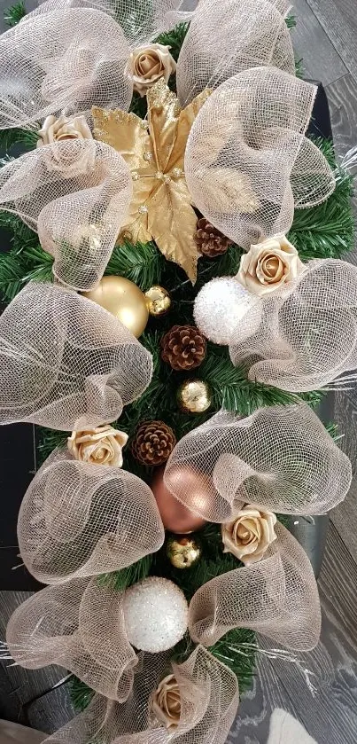 Elegant golden holiday ornaments with lush greenery and ribbons.