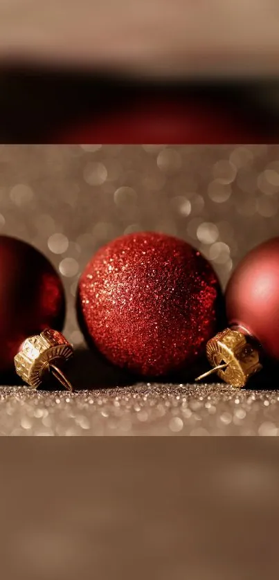 Red Christmas ornaments with festive background.