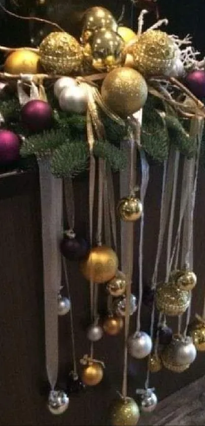 Christmas ornaments with gold, silver, and purple on green sprigs.