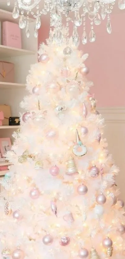 Elegant white Christmas tree with pastel ornaments and chandelier.