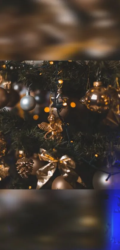 Elegant golden decorations on a Christmas tree with warm festive lights.