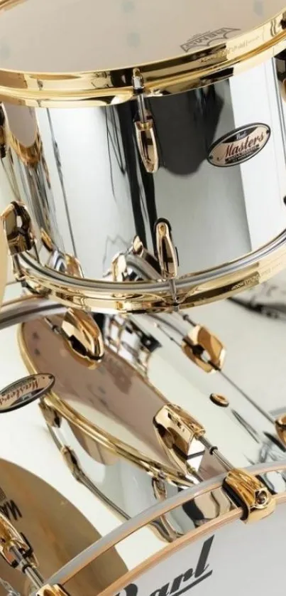 Chrome drum set with gold accents for mobile wallpaper.