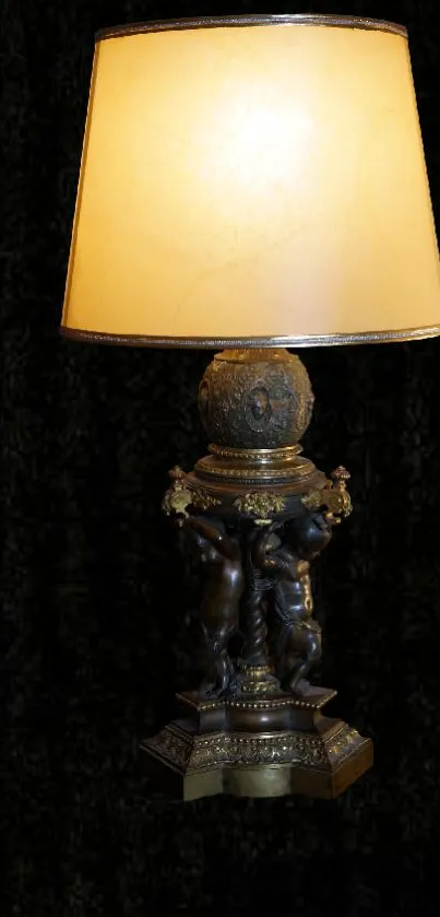 Elegant classic table lamp with warm light on a black background.