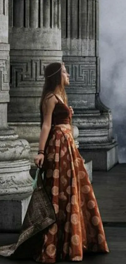 Woman in a gown by grand architectural columns.