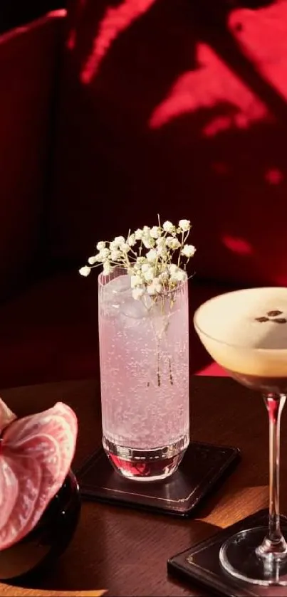 Elegant cocktail setting with red sofa background.