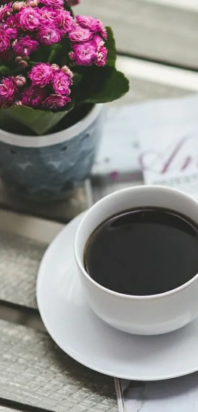 Coffee cup with pink flowers on a wooden table.