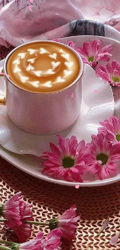 Coffee cup with pink flowers on a heart-shaped plate.