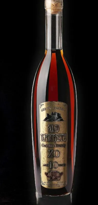 Elegant cognac bottle against a black background.