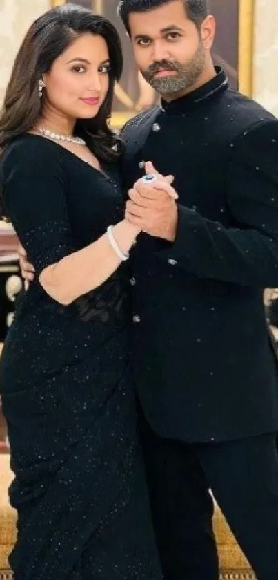 Couple dancing elegantly in black attire.