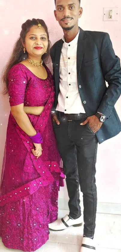 Elegant couple in formal attire with magenta dress.