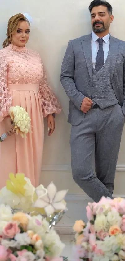 Elegant couple in stylish attire with floral decor.