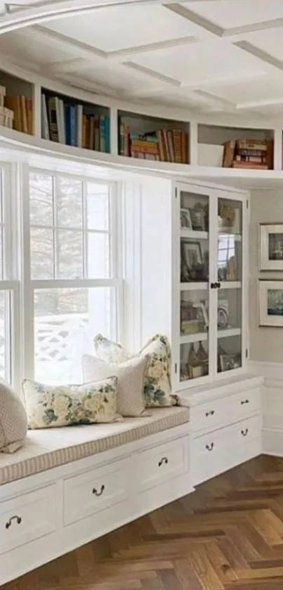 Elegant reading nook with white shelves and window seat.