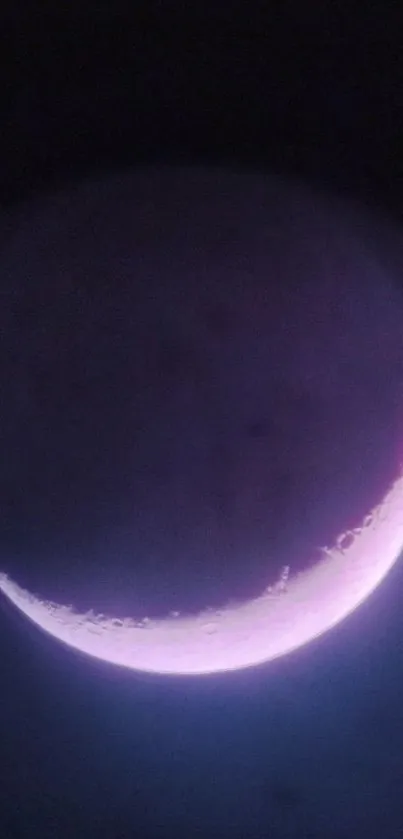 Crescent moon with a pink glow against a dark purple background.