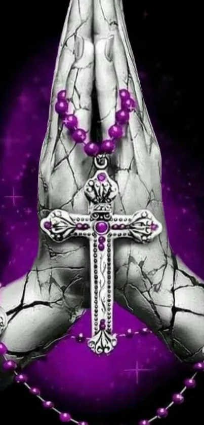 Hands holding a silver cross with a purple halo and beads on a dark background.