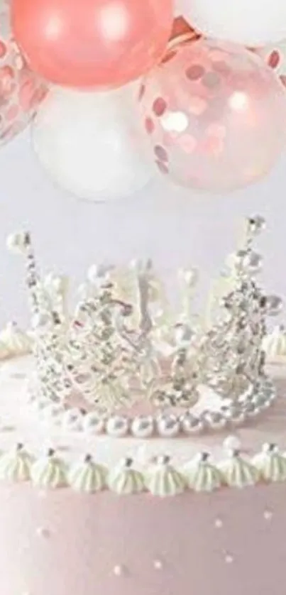 Crown on pink cake with balloons.