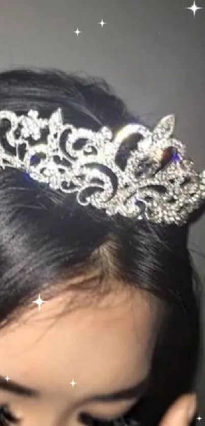 Close-up of a silver crown on dark hair, stylish wallpaper.