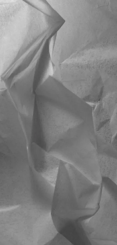 Monochrome crumpled paper texture mobile wallpaper.