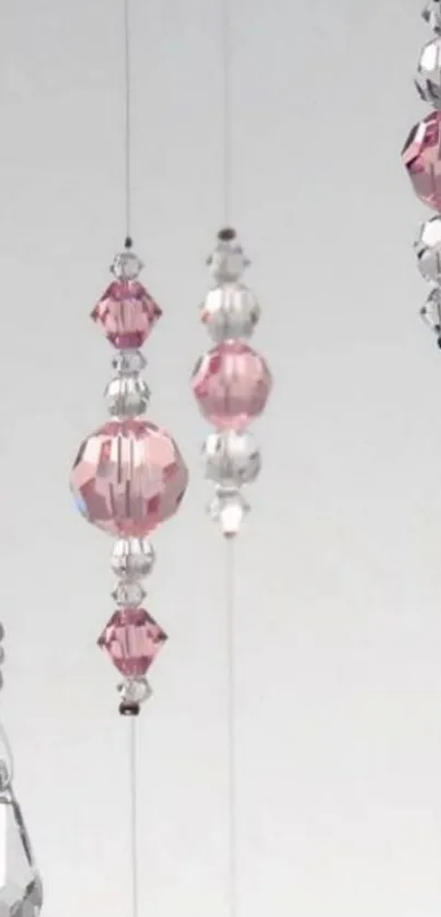 Elegant mobile wallpaper featuring pink and clear crystal beads.