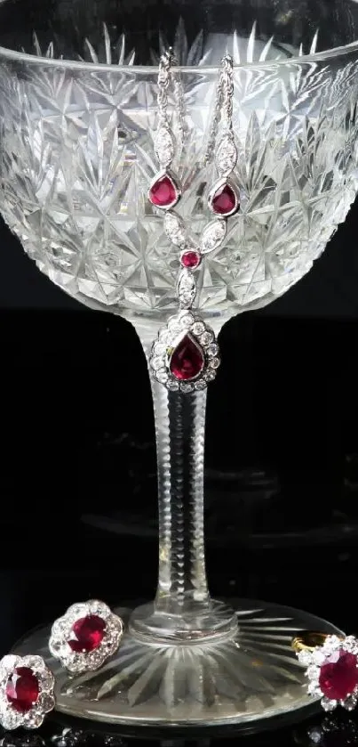 Crystal glass with ruby accents on black background.