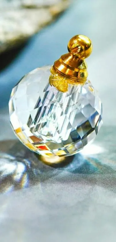 Elegant crystal ornament with gold accent on fabric.