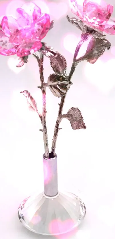 Pink crystal rose with silver stem in vase on white background.