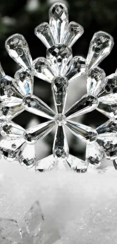 Elegant crystal snowflake on a snowy background wallpaper.