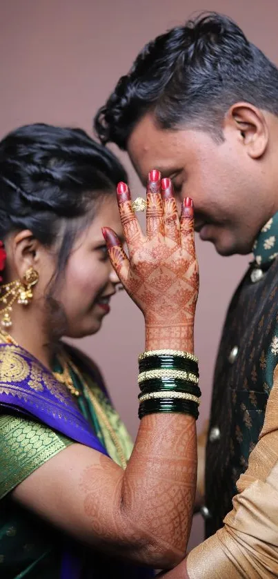 Couple in traditional attire sharing an intimate moment.