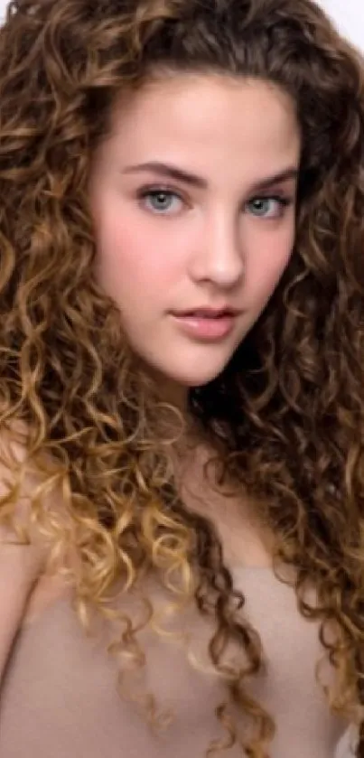 Portrait of a woman with elegant curly hair, exuding grace and natural beauty.