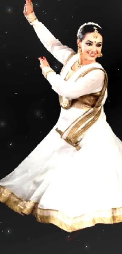 Dancer in a graceful pose wearing a white dress on black background.