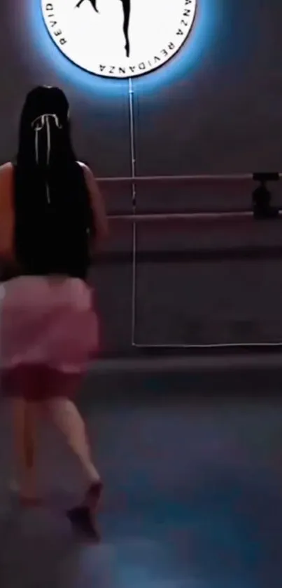 Back view of woman dancing in studio.