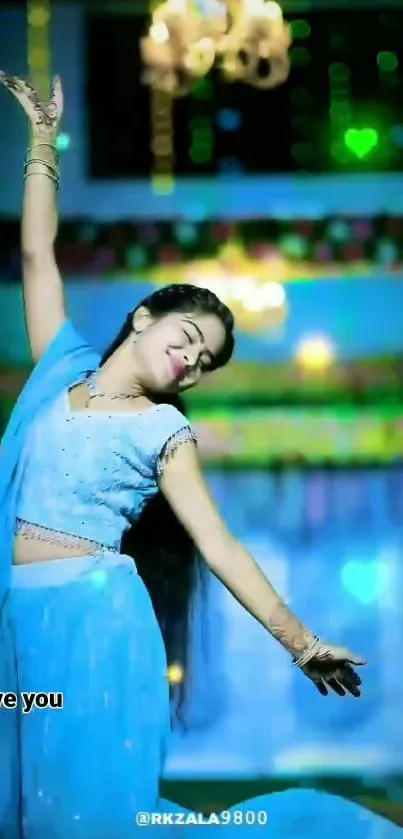 Elegant dancer in a vibrant blue setting with graceful pose.