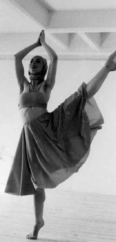 Monochrome image of an elegant dancer performing a graceful pose.