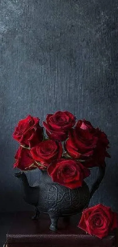 Dark bouquet of deep red roses in a vase with a textured black background.