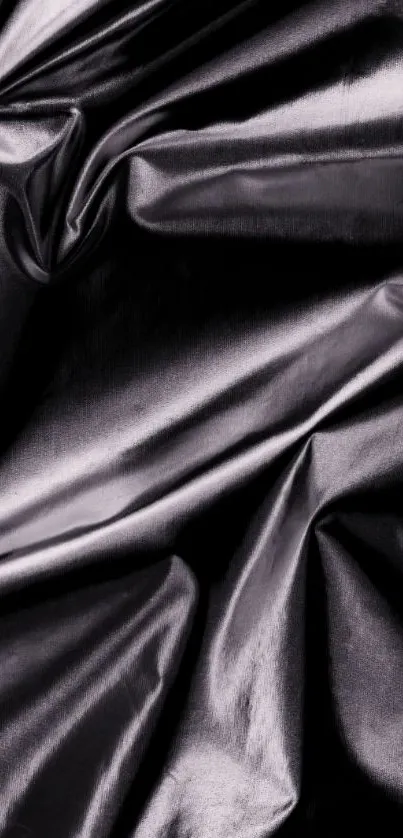 Dark satin fabric with elegant texture.