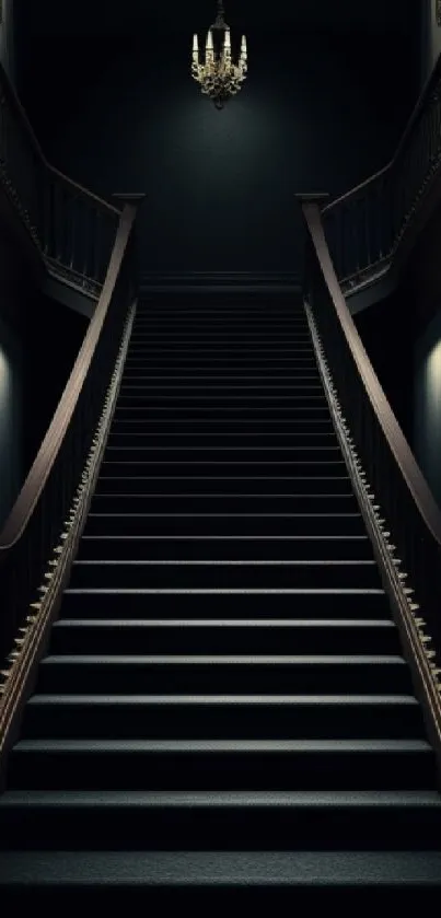 Dark staircase with chandelier lighting.