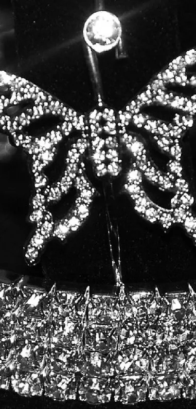 Elegant diamond jewelry on black background with butterfly motif.