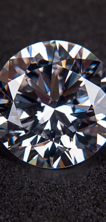 Glistening diamond with sharp facets on a textured black background.