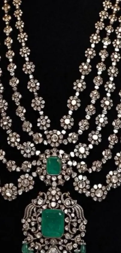 Elegant diamond and emerald necklace on black background.