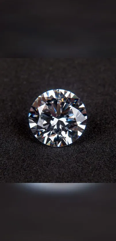 A sparkling diamond on a black surface, ideal as an elegant mobile wallpaper.