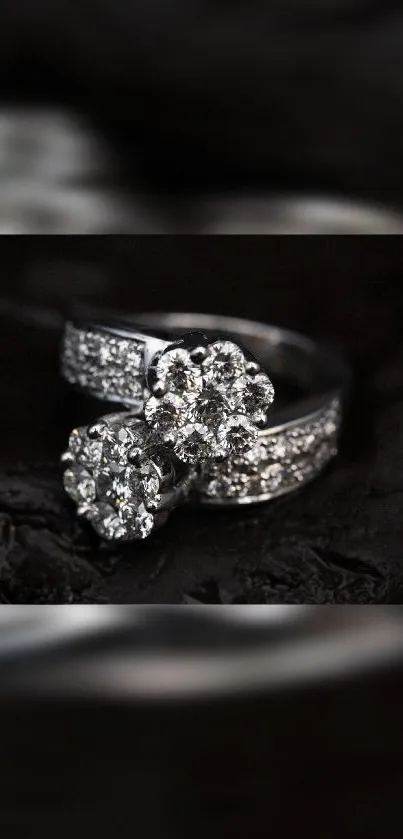 Elegant diamond ring with sparkling jewels on a sleek black background.