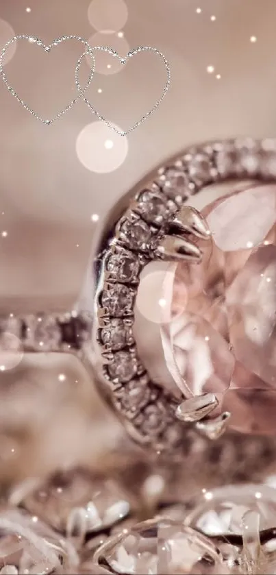 Soft pink diamond ring on sparkling jewelry background.