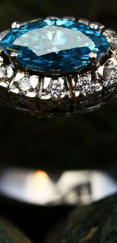 Stunning mobile wallpaper of a diamond ring with a blue gemstone setting.