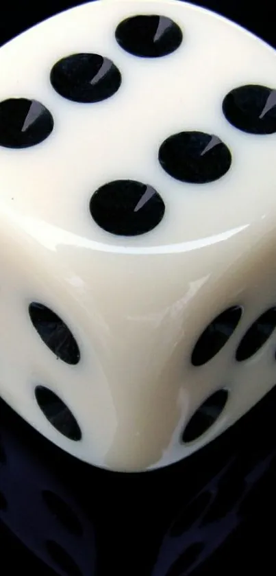 Ivory dice with black dots on a sleek dark background.