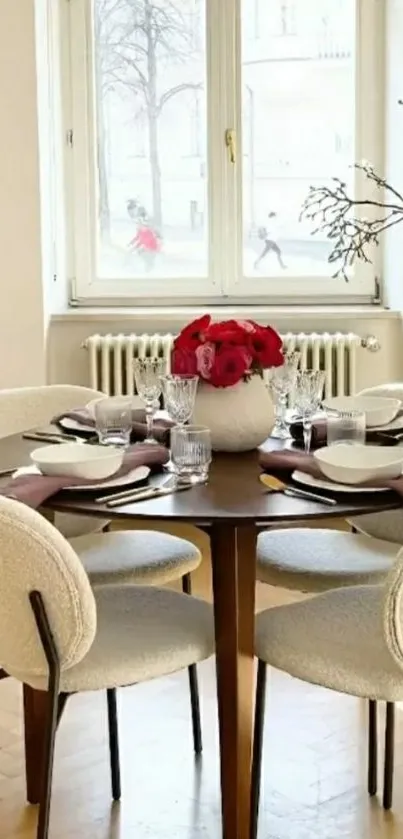 Elegant dining room with table setting and red flowers.