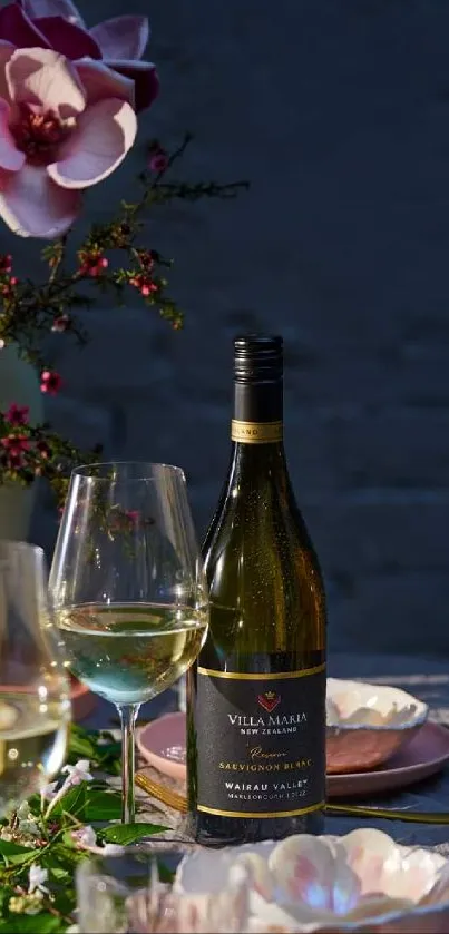 Elegant dinner table setting with wine and flowers.