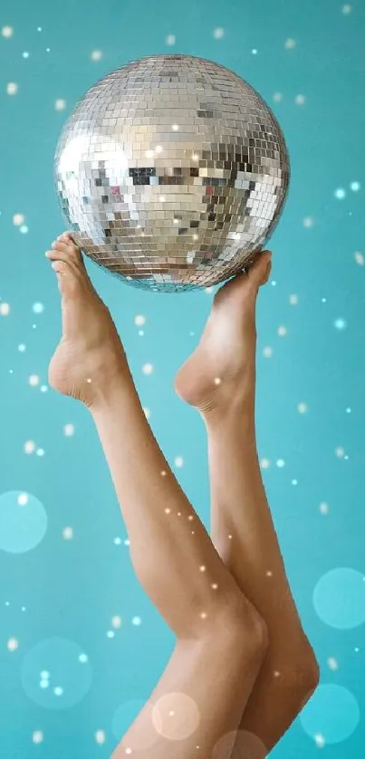 Elegant disco ball balanced on feet against a light blue background.