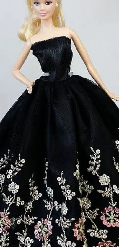 Elegant doll wearing black floral embroidered dress.